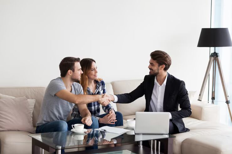 young couple family meeting with realtor interior designer decorator landlord making deal husband handshaking with man suit concept meeting with client customer 656932 5730 converted